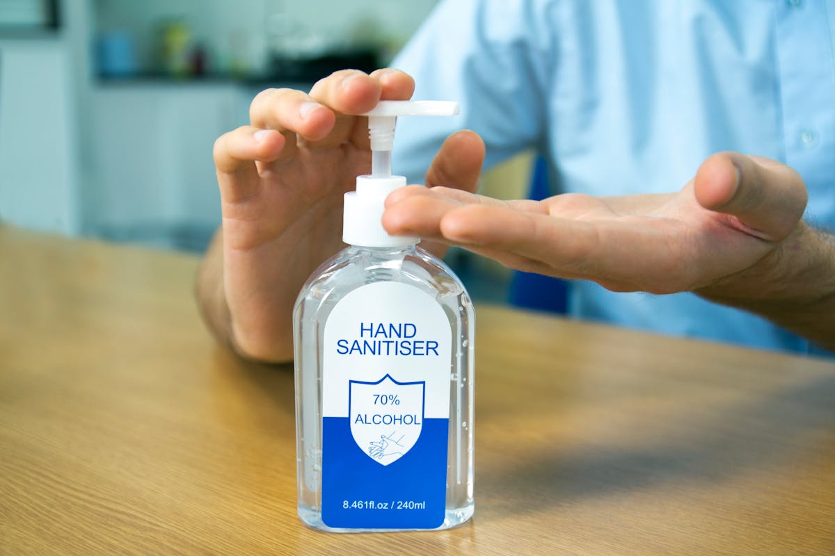 Person pumping hand sanitizer